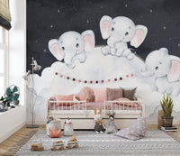 Sleepy baby elephants in cloud mural
