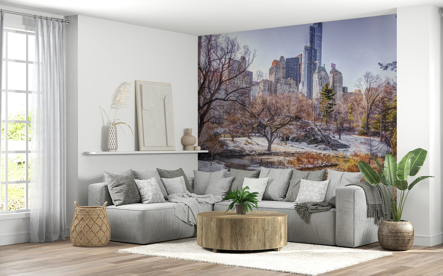 Snowy Central Park wall mural in a modern living room with neutral tones.