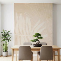 Soft tropical wall mural featuring cream leaf shapes and muted natural tones