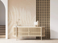 Minimal botanical wall mural with pale foliage print on a textured beige base