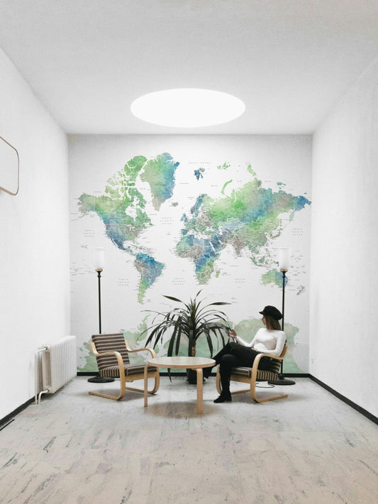 Soft green watercolor world map art

