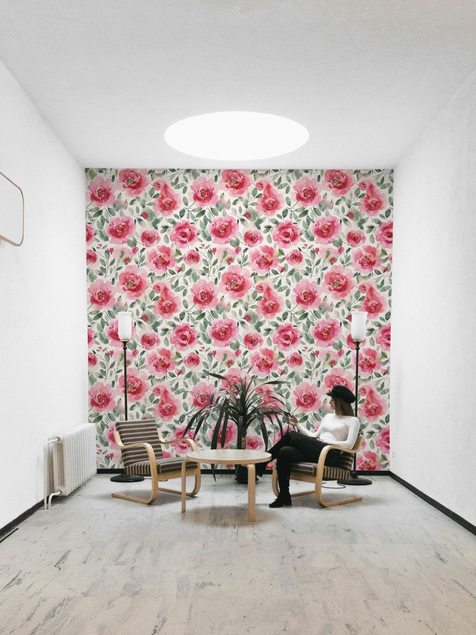 Soft watercolor roses in red and green on wallpaper

