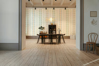 The design features a repeating pattern of soft, fluid scallops.

