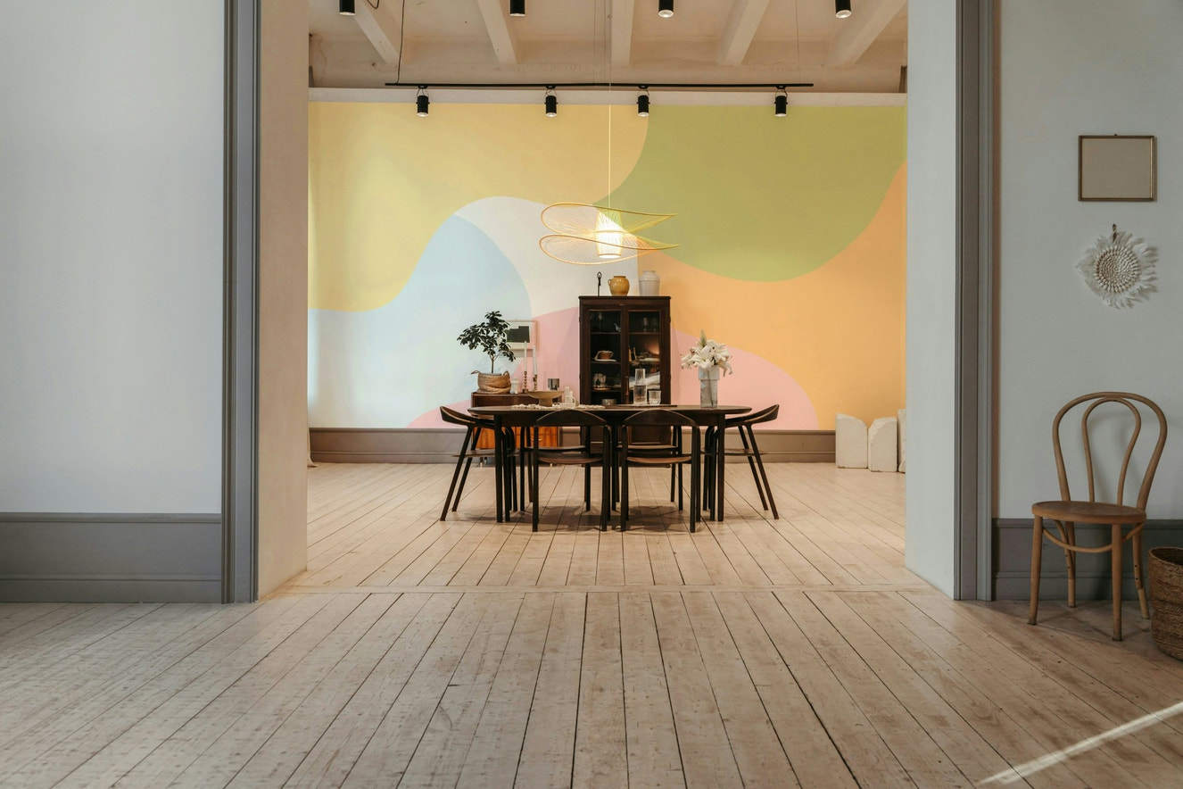 An abstract wall mural featuring a pattern of soft, organic shapes.

