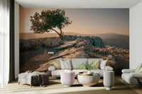 Stunning dusk mural featuring a lone tree design.

