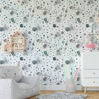 Space-inspired mural with galaxy and starry sky.