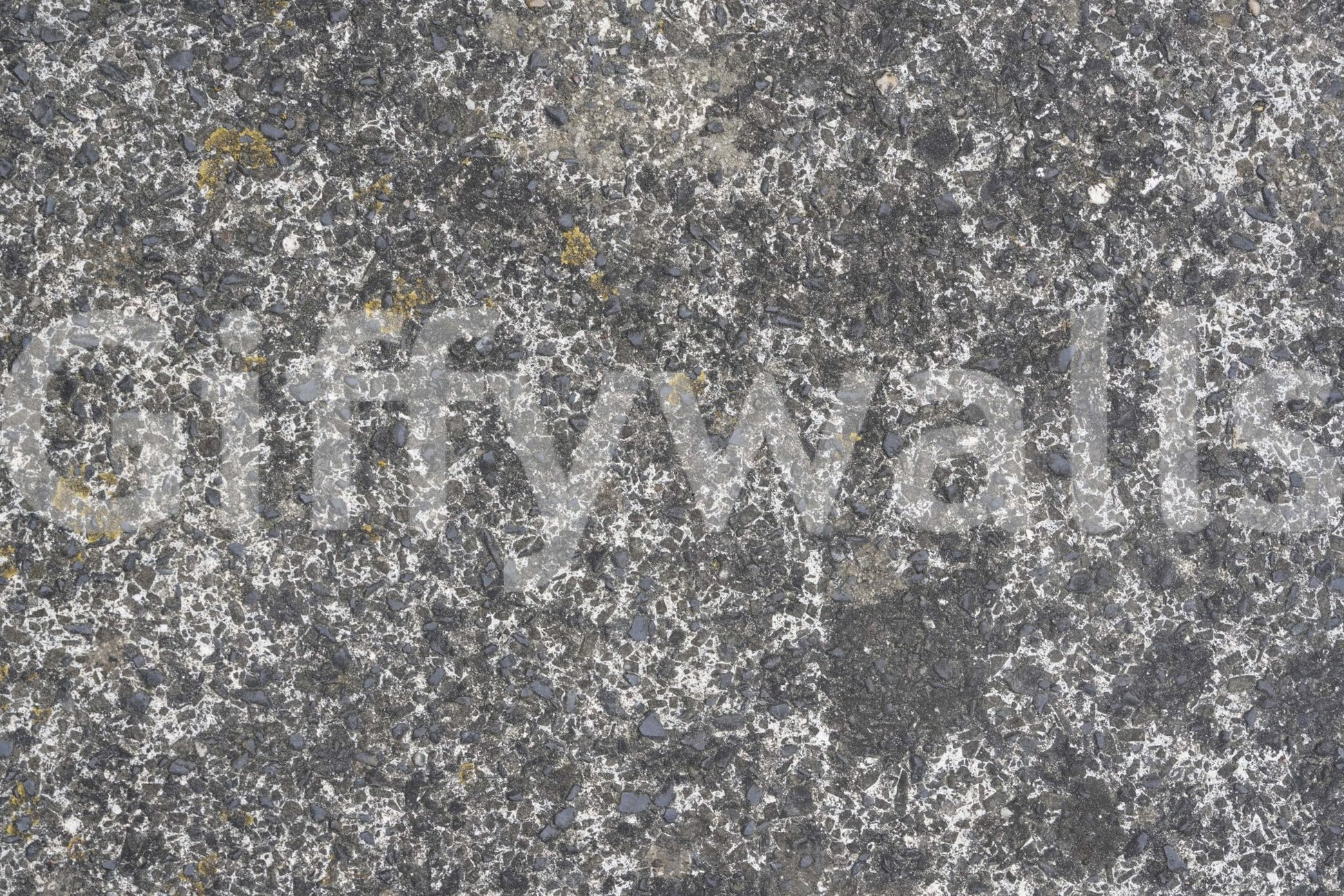 Full wall view of speckled stone wallpaper mural.