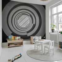 A bright Kids Play area styled with Spiral Ascent Wall Mural and a light neutral sofa
