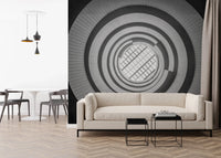 A low-profile sofa sits before Spiral Ascent Wall Mural in this relaxed living room