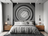 This bedroom uses Spiral Ascent Wall Mural as a bold backdrop behind the grey bed