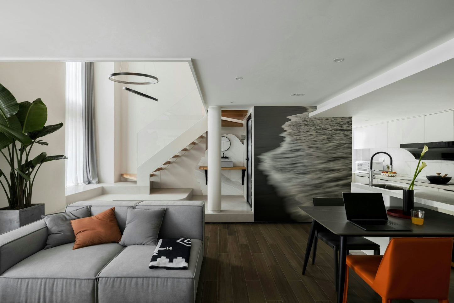 A minimalist interior with the ocean-themed wallpaper.

