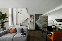 A minimalist interior with the ocean-themed wallpaper.


