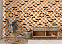 Repeating flying bat motif over orange and white wallpaperGD9458