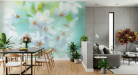 Floral wallpaper featuring soft green leaves and white buds.