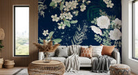 Detailed floral wall mural with white petals, green foliage, and dark contrast