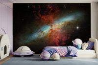 Stardust Symphony wallpaper behind a velvet sofa in a lounge.