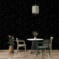 The Starry Night Symphony Wallpaper on a bedroom wall.
