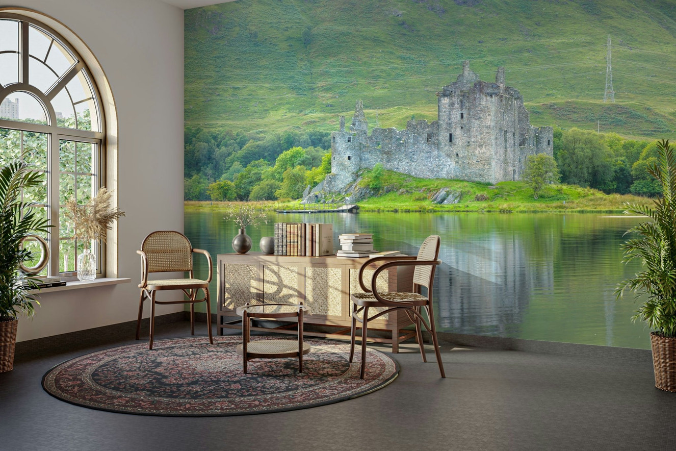 A peaceful wall mural with a view of a castle.


