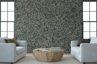 Stone aggregate wallpaper mural behind a minimalist sofa., GD6052