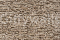 Textured Stone Cladding wallpaper on a living room wall.