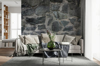 Close-up texture of dark grey peel and stick wallpaper.