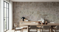 Close-up of stone mosaic mural's intricate tile texture.