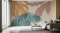 Muted tropical wall mural in mauve, beige, and blue with flowing leaf shapes