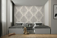 A bedroom decorated with a subtle wallpaper

