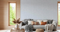 Home office with Modern Abstract Watercolor Strokes wallpaper behind a minimalist wooden desk and brass lamp GD9522