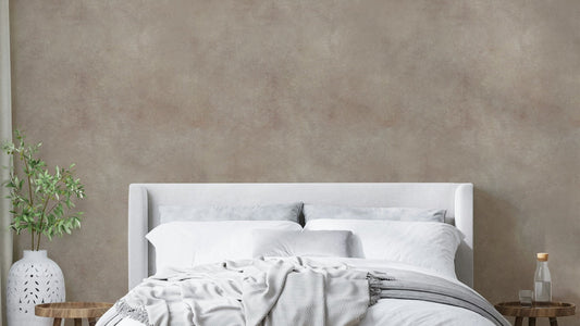 Delicate pink wallpaper with brushed leather texture.

