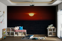 A beautiful dramatic sunset over the ocean wallpaper mural.

