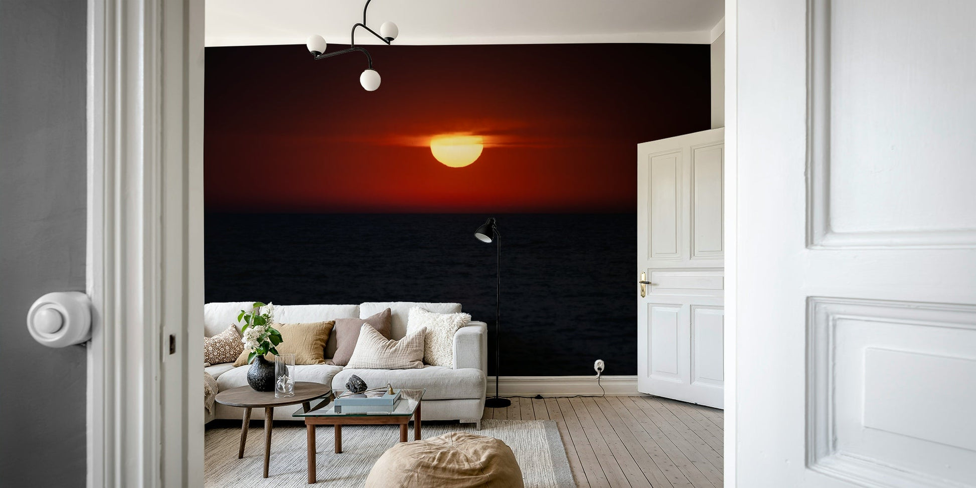 An artistic ocean sunset mural on minimalist wallpaper.


