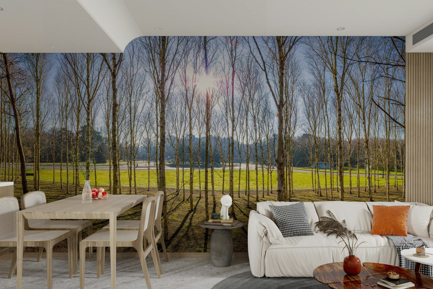 The ground is covered with grass and leaves.

