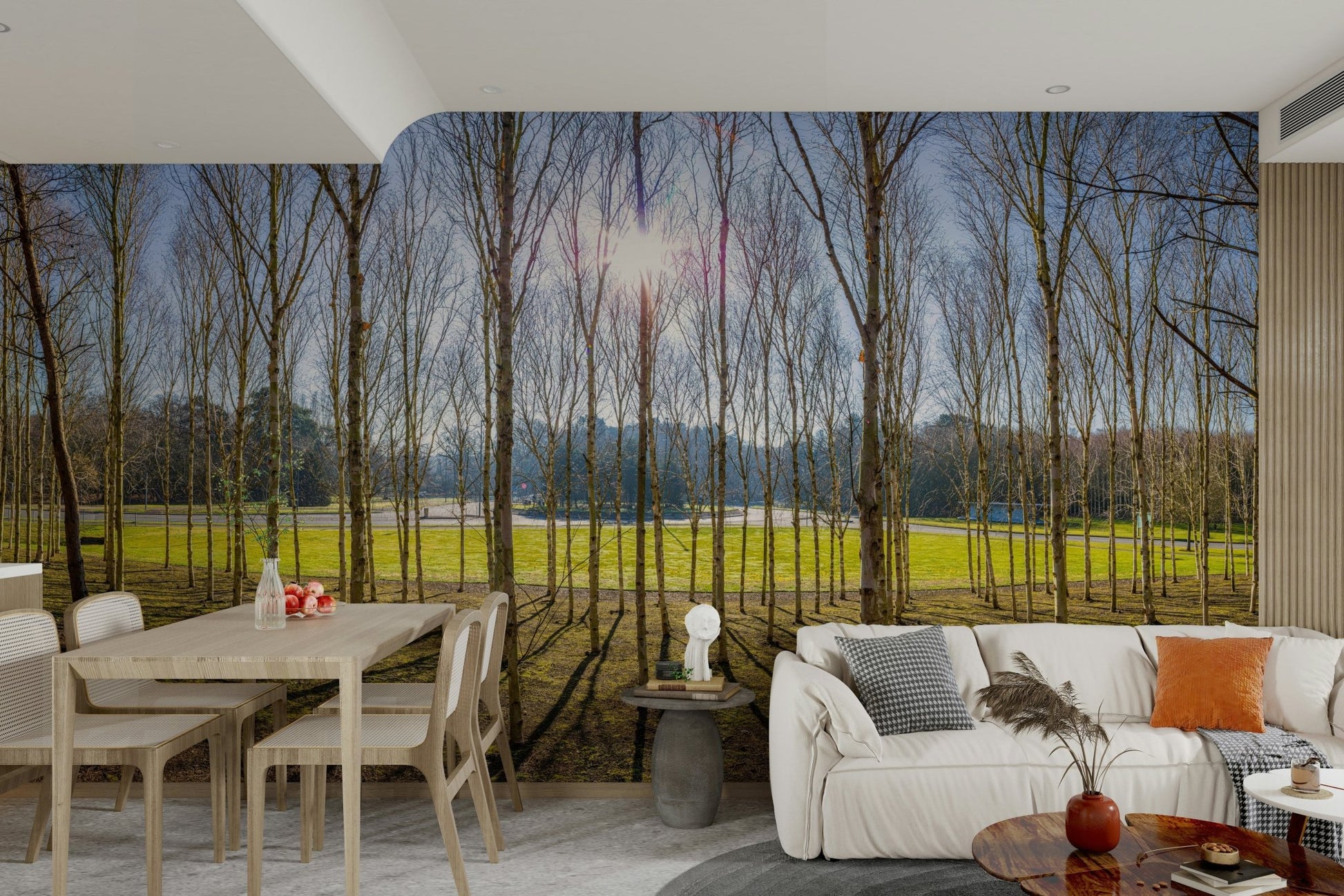 The ground is covered with grass and leaves.

