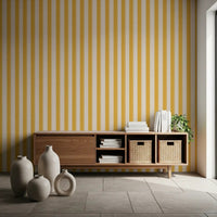 Reading nook with Sunny Stripes Wallpaper and soft golden vertical stripes