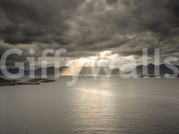 Natural light over mountain silhouettes gives this Sunset Fjord Wall Mural depth