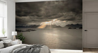 Sunbeams breaking over the sea define the Sunset of Norwegian Fjord Wall Mural