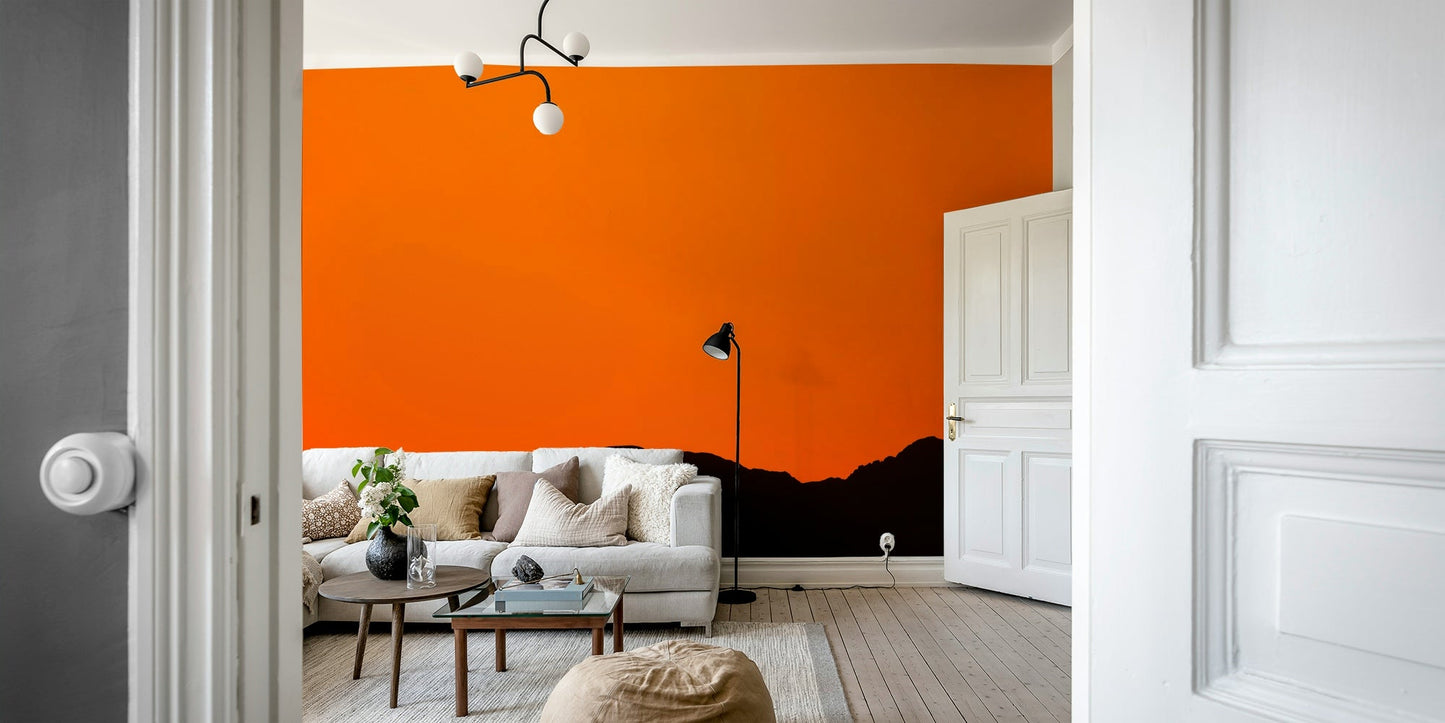 A peaceful mountain landscape mural on decorative wallpaper.

