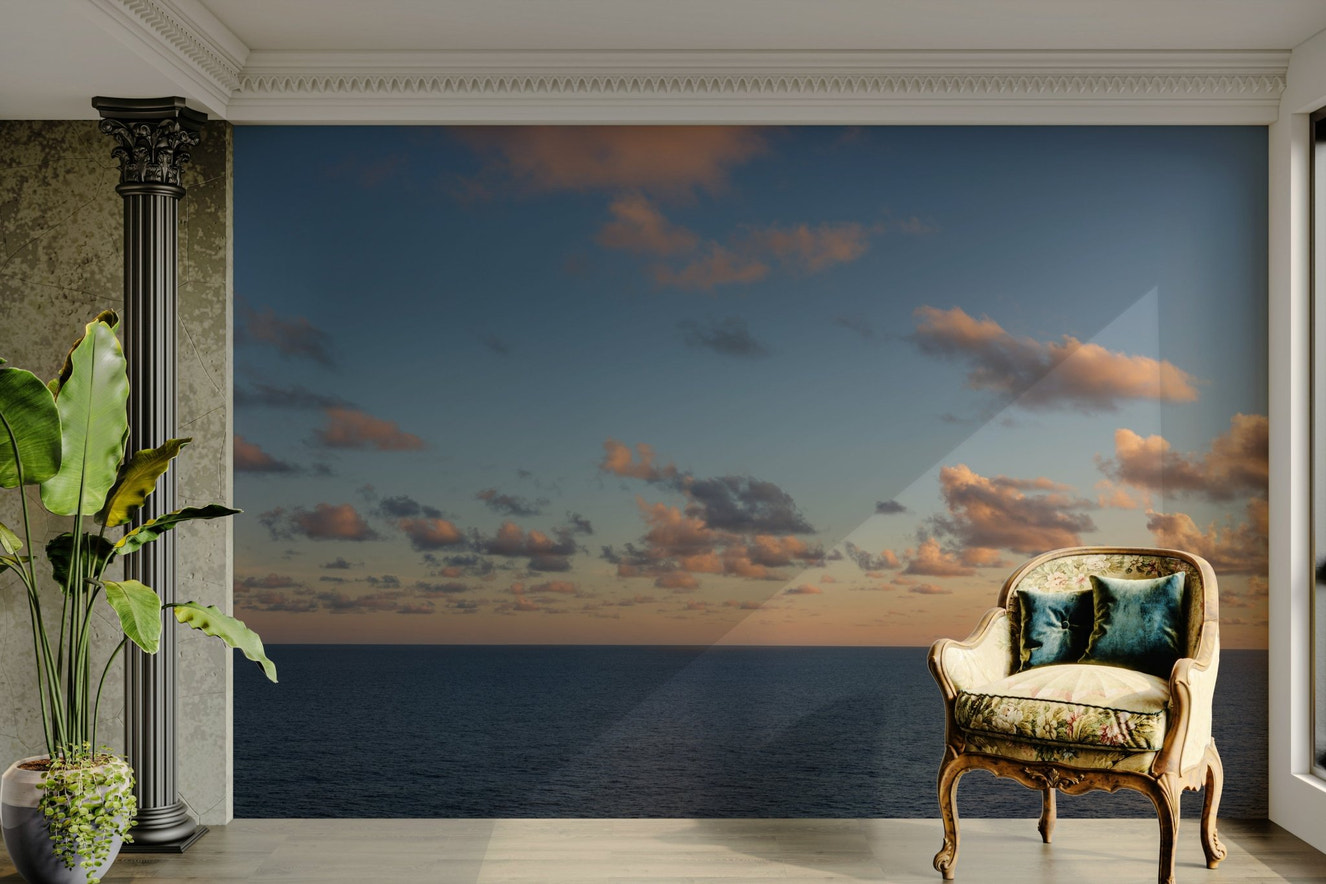 A beautiful panoramic sunset wallpaper mural over the ocean.

