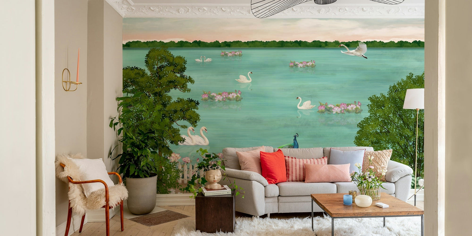 The image features two elegant swans on the water.
