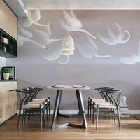 Dreamy swans soaring over neutral backdrop
