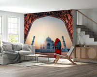 Living room backdrop features sunset Taj wall mural with glowing sky and minarets