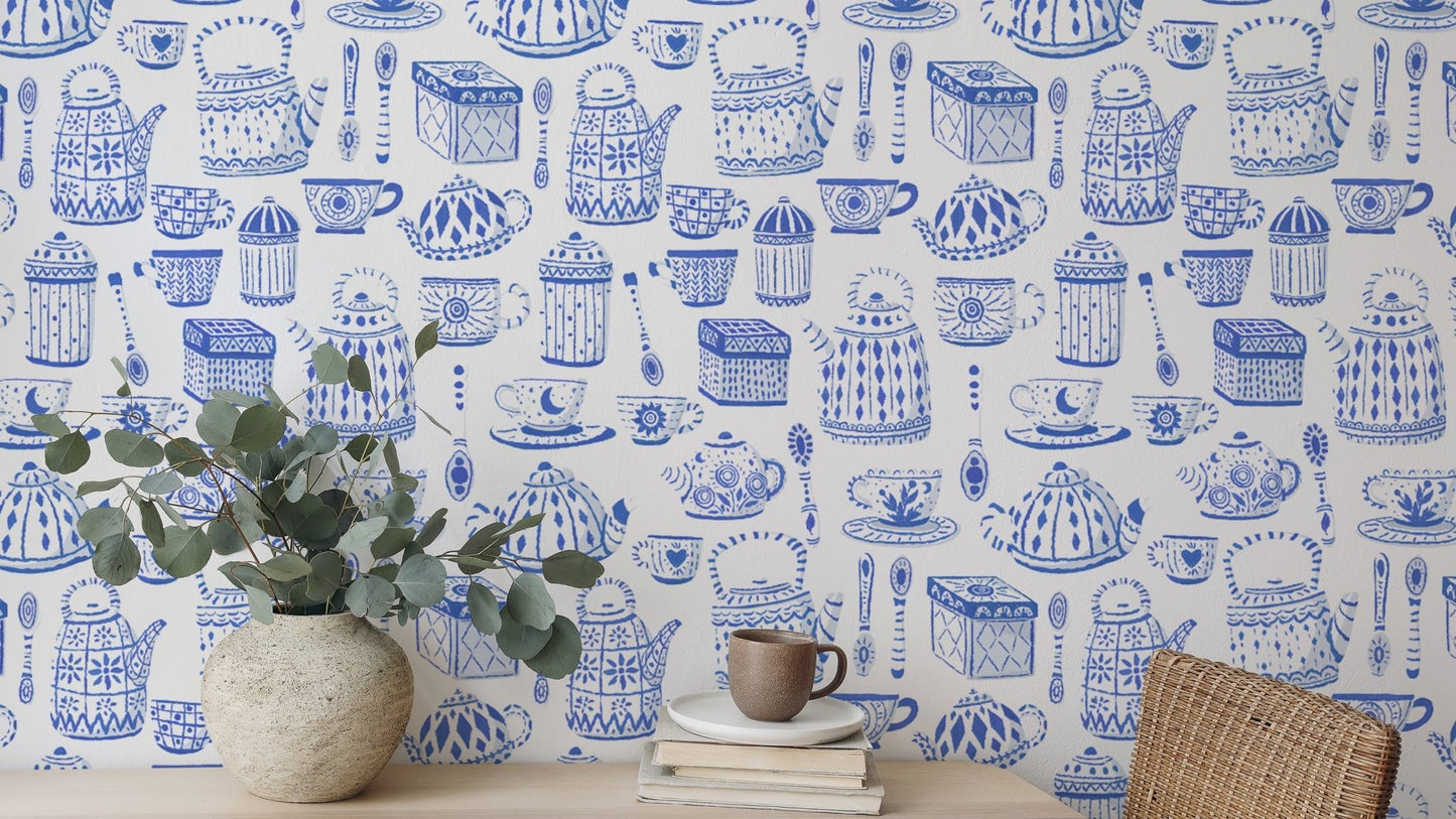 Elegant tea set in blue wallpaper for a calming kitchen vibe.
