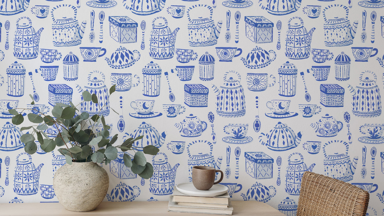 Elegant tea set in blue wallpaper for a calming kitchen vibe.
