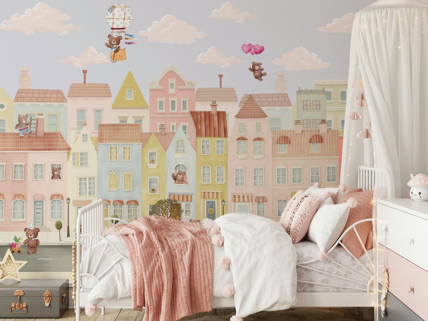 Teddy's Town Wall Mural behind a wooden toy chest in a nursery wallpaper.