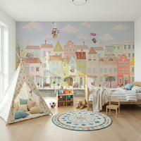 Teddy's Town Wall Mural in a bright nursery with white crib wallpaper.