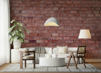 Sofa against the Terracotta Brick wallpaper mural.