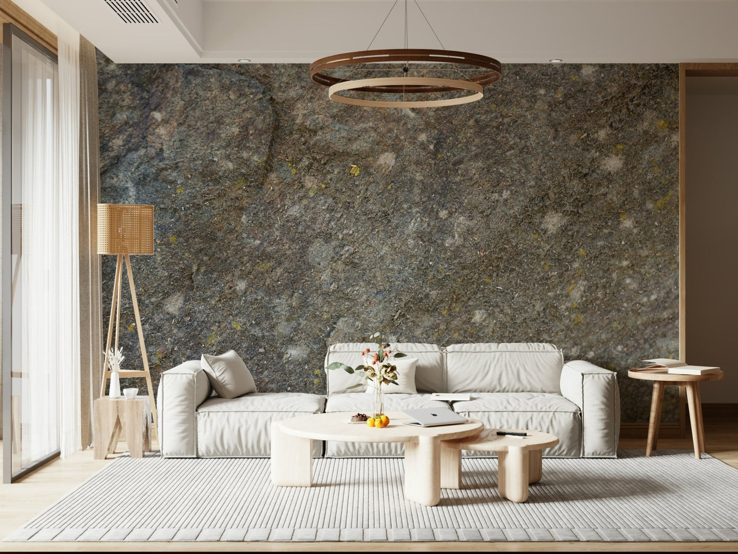Textured rock surface wall mural in living room.