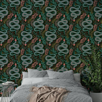 Vibrant patterned snakes in forest setting

