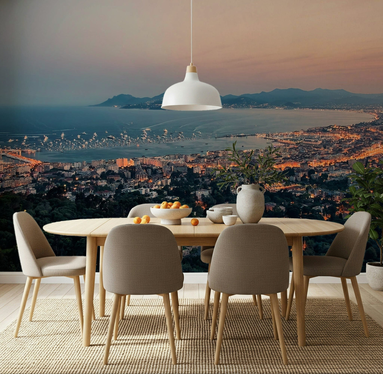 Dining room with The Bay of Cannes Wall Mural and a glowing coastal skyline